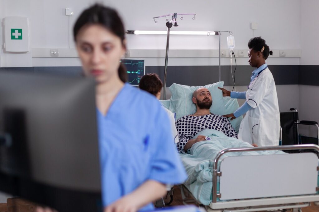 black doctor checking hospitalized sick man monitoring sickness symptom recovery appointment 482257 2672