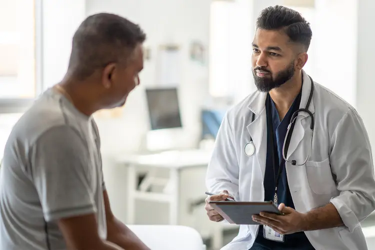 1800ss getty rf doctor listening to male patient