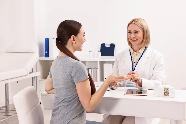 imgi 20 weight loss smiling nutritionist consulting patient table clinic 495423 116010
